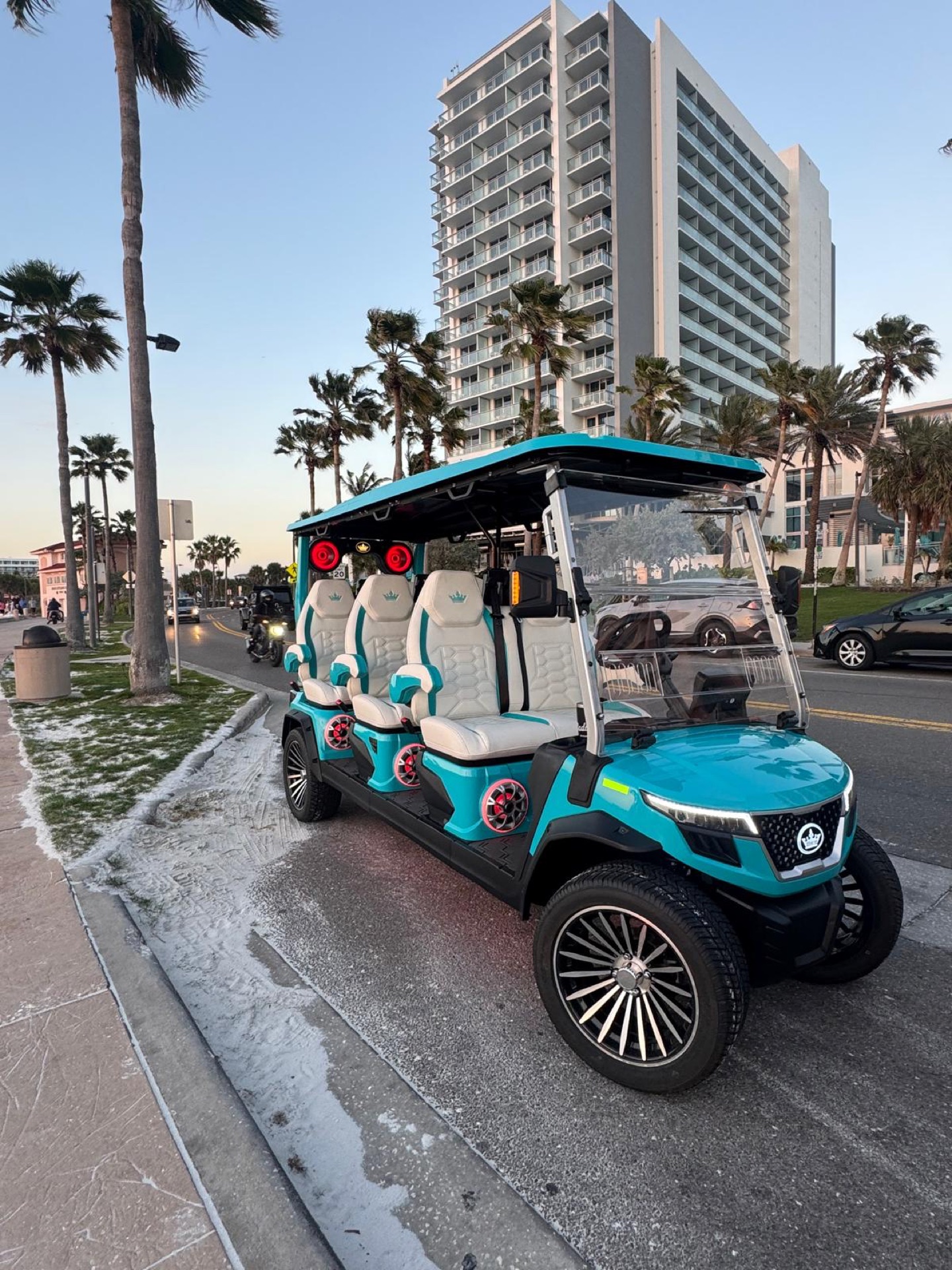 6-passenger Sandy cart parked by a Clearwater Beach hotel